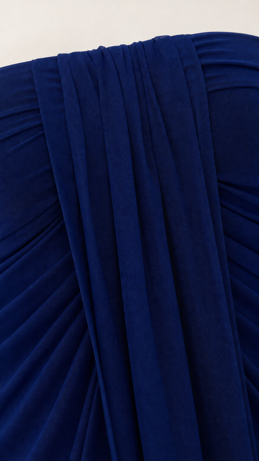 Close-up detail of smooth-looking royal blue chiffon fabric and ruching