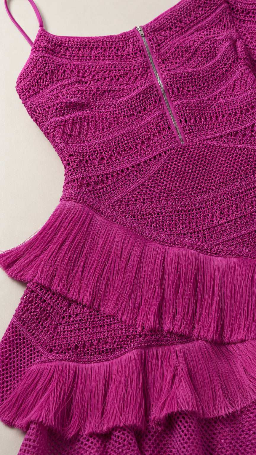 Close-up detail of upper bodice and tiered fringe on fuchsia dress