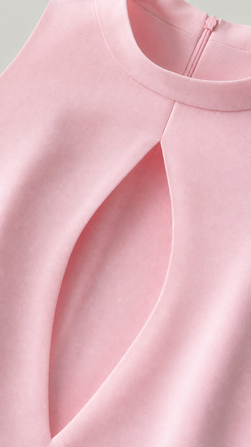 Close-up detail of smooth pink fabric and keyhole cutout