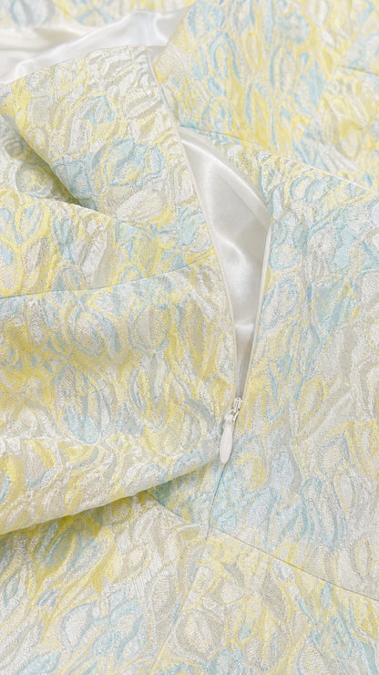 Close-up detail of side zipper and jacquard fabric texture