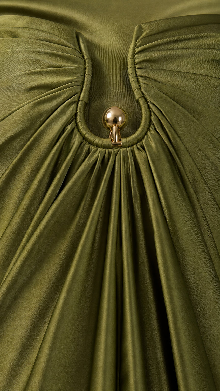Close up of neckline hardware detail on olive satin dress
