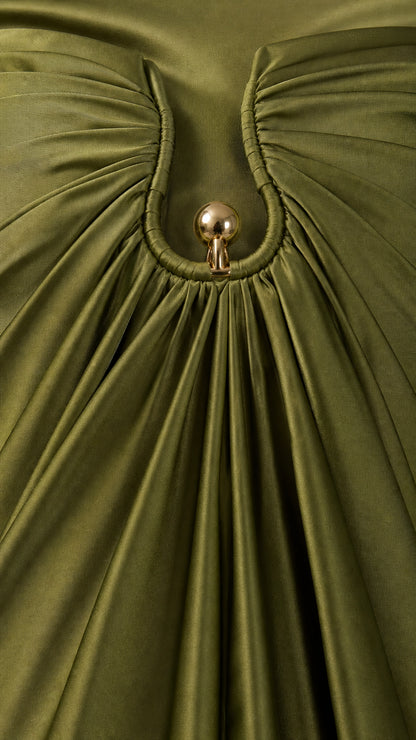 Close up of neckline hardware detail on olive satin dress