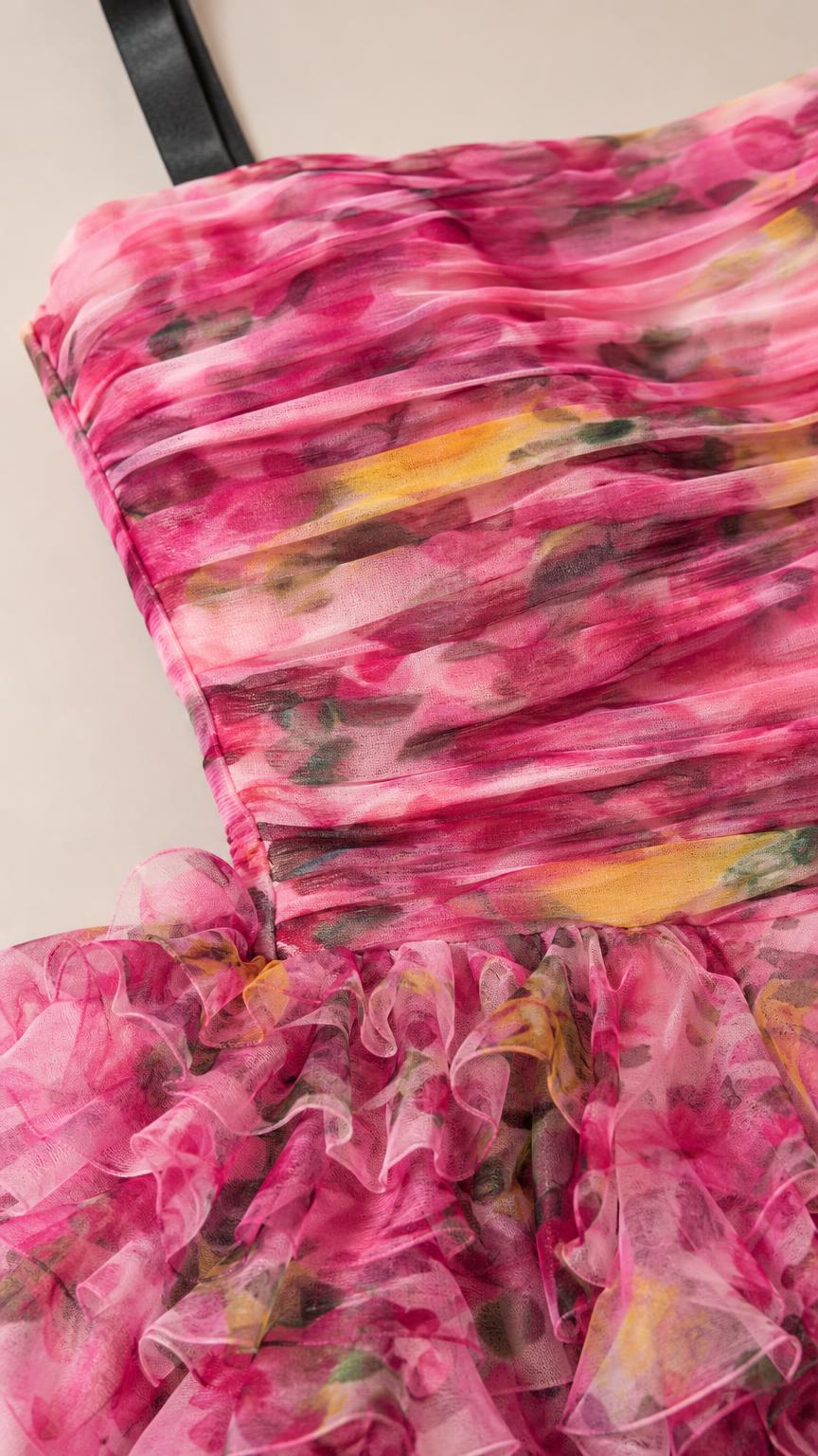 Close-up detail of the ruched bodice and floral textured fabric