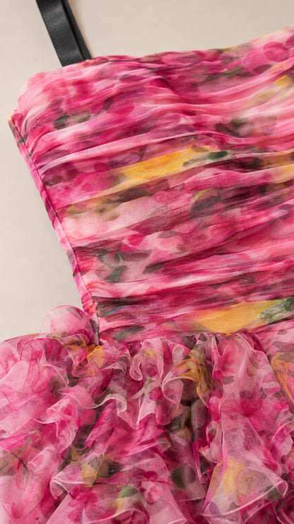 Close-up detail of the ruched bodice and floral textured fabric
