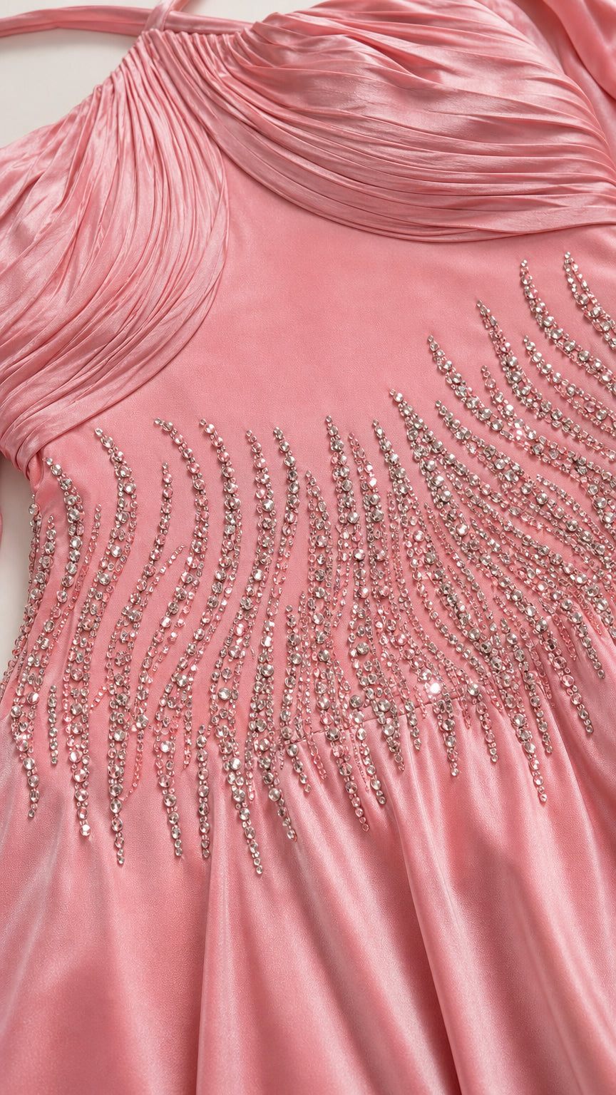 Close up of crystal embellished bodice on pink satin dress