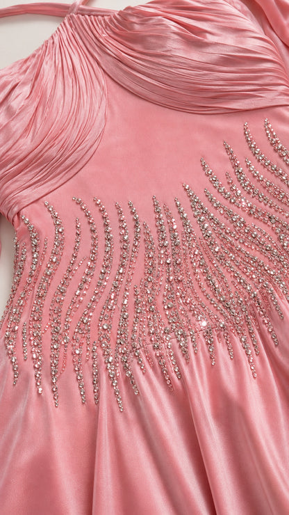 Close up of crystal embellished bodice on pink satin dress