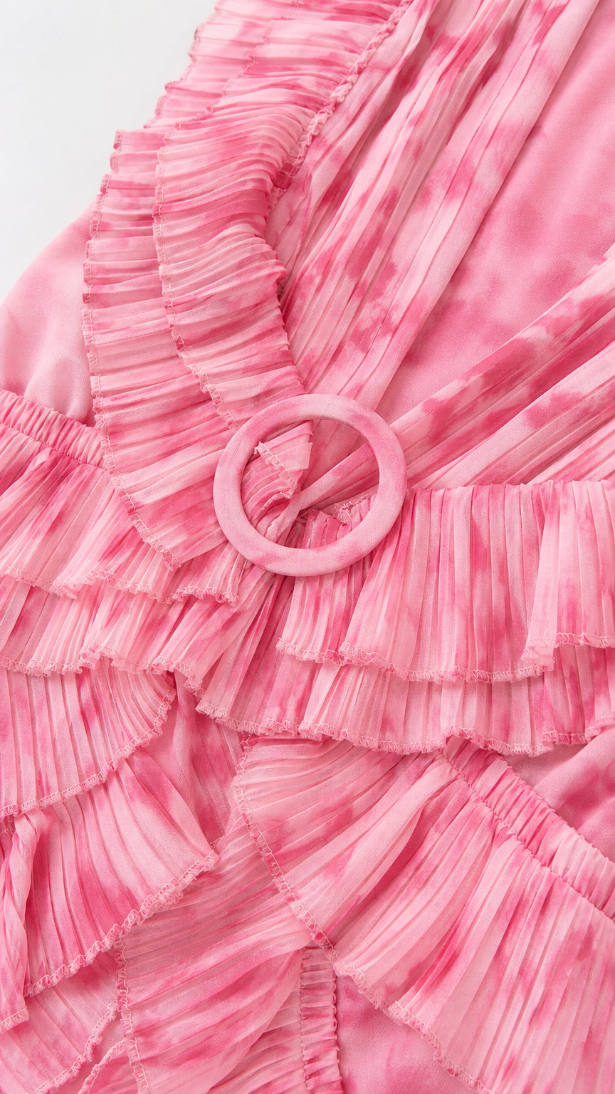 Close-up of fabric texture and O-ring belt on pink dress