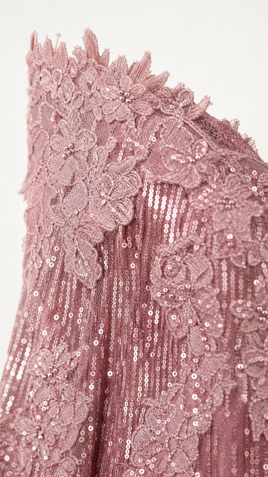 Close-up detail of sequin and lace embroidery on bodice