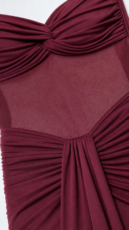 Close-up detail of twist bodice and sheer midsection panel