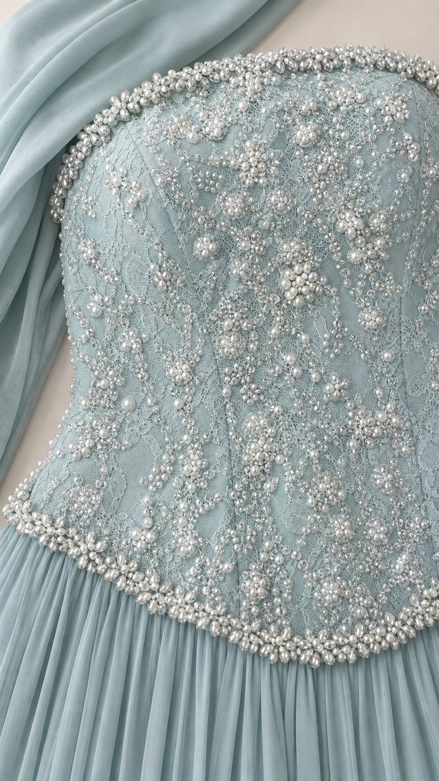Close-up detail of beaded and pearl embellished corset bodice