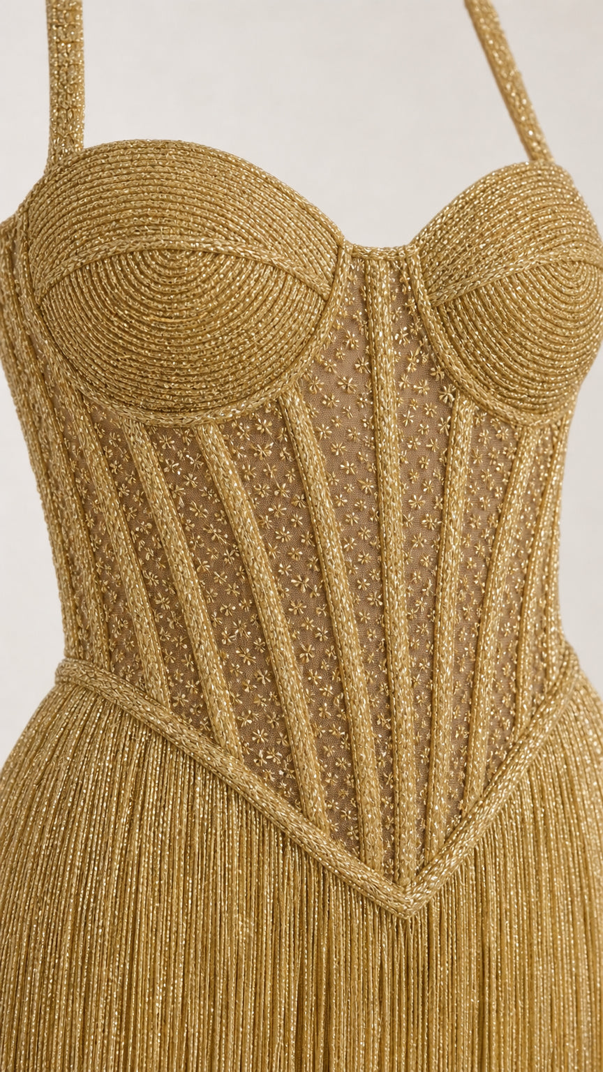 Close-up detail of structured corset bodice and glittering fabric