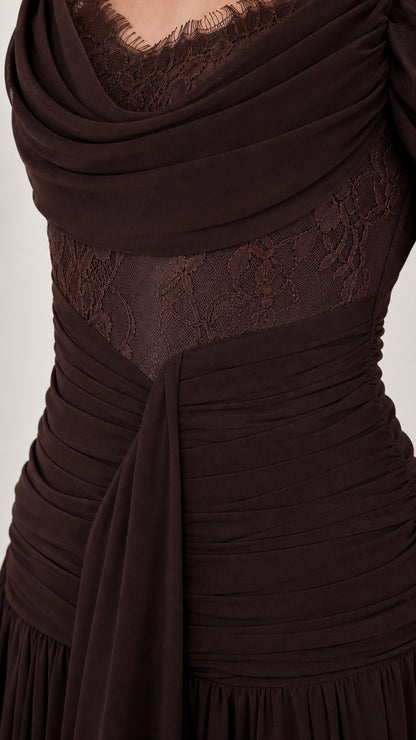 Close-up detail of draped bodice and lace trim
