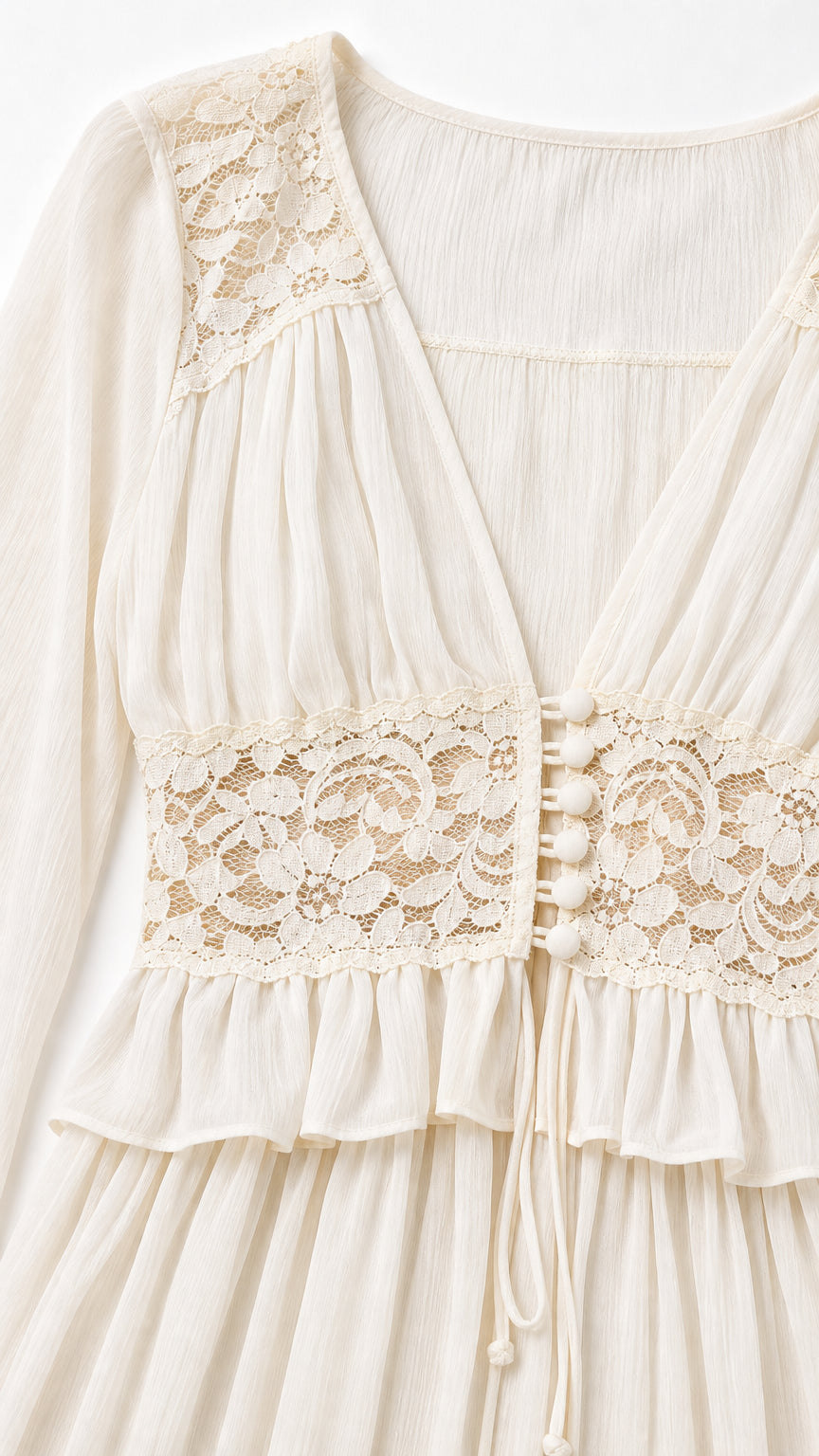 Close-up detail of lace bodice and V-neckline on cream maxi dress
