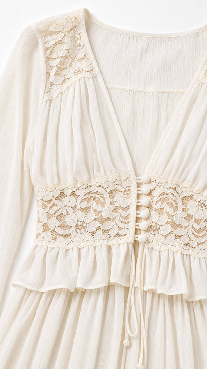 Close-up detail of lace bodice and V-neckline on cream maxi dress