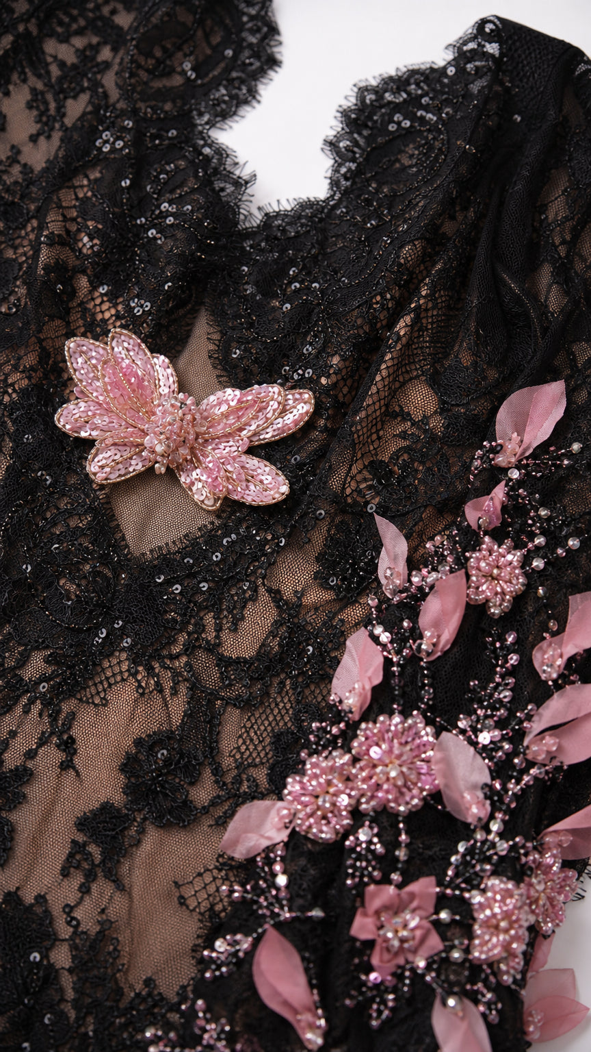 Close-up of lace bodice and butterfly applique detail
