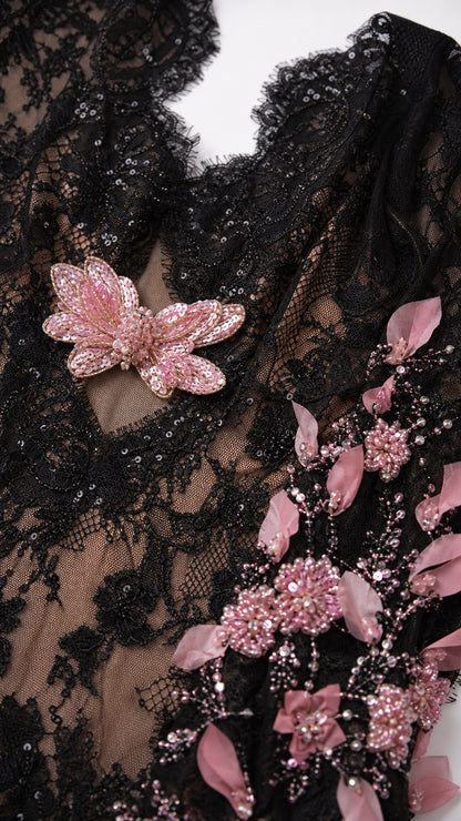 Close-up of lace bodice and butterfly applique detail