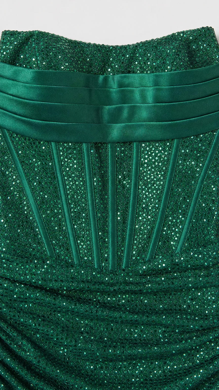 Close-up detail of the pleated bust and corset boning on the green glitter dress