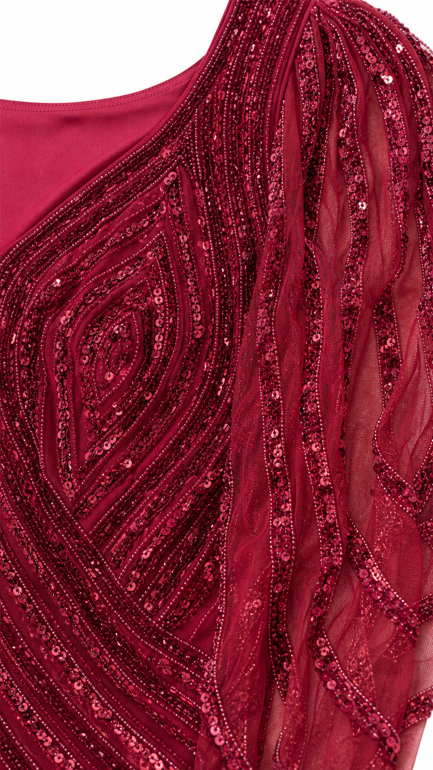 Close-up detail of burgundy sequin and bead chevron embroidery on mesh