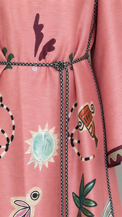 Close-up detail of pink dress print and belt