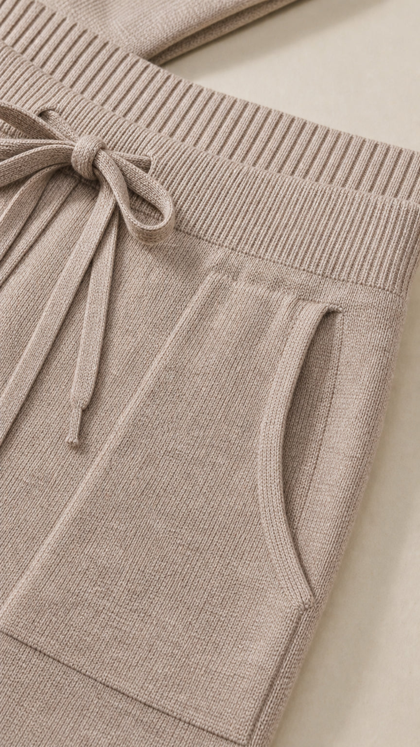 Close-up of the taupe drawstring waistband and side pocket detail