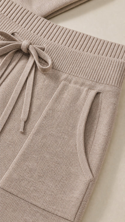 Close-up of the taupe drawstring waistband and side pocket detail
