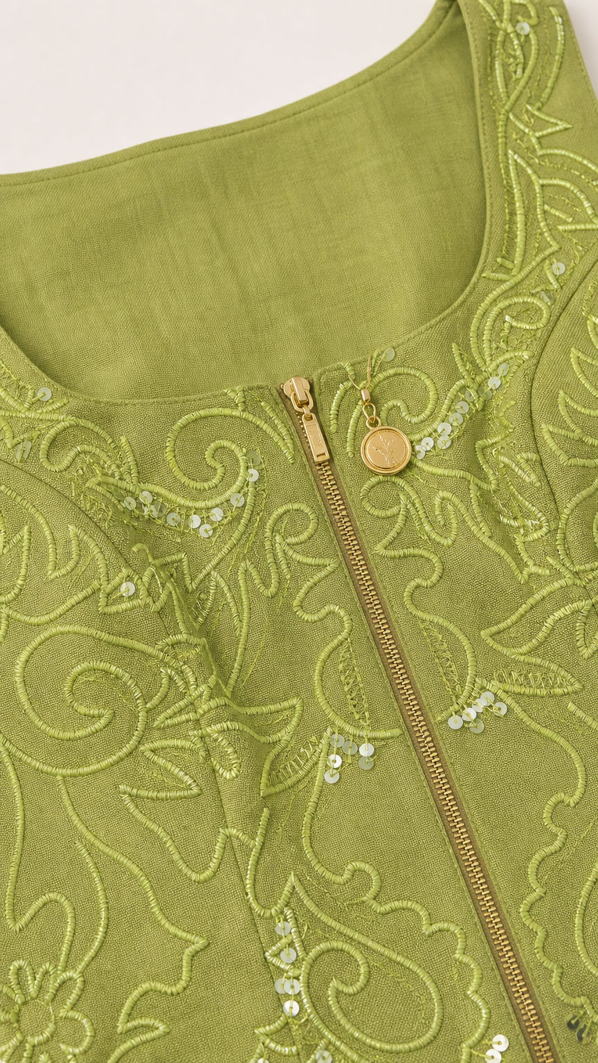 Close up of green tank top neckline embroidery and zipper