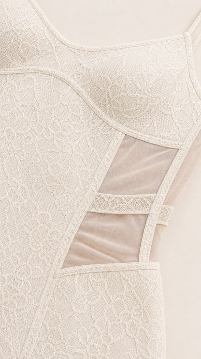 Close-up detail of bodice texture and sheer mesh side panels