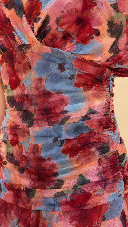 Close-up detail of fabric texture and ruching on multi pink floral dress