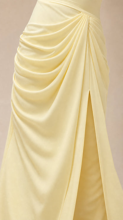 Close-up detail of front cascading ruching and high slit on yellow dress
