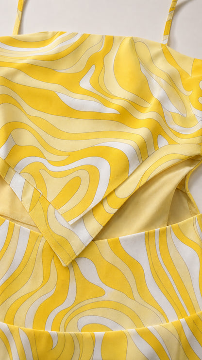 Close-up detail of the textured fabric, neckline, and cutout