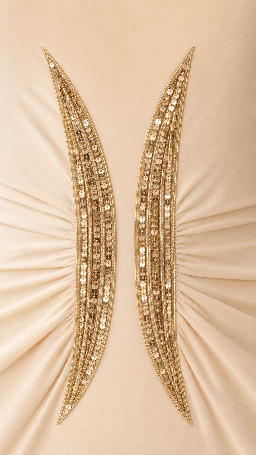 Close-up detail of intricate gold sequin and bead embroidery