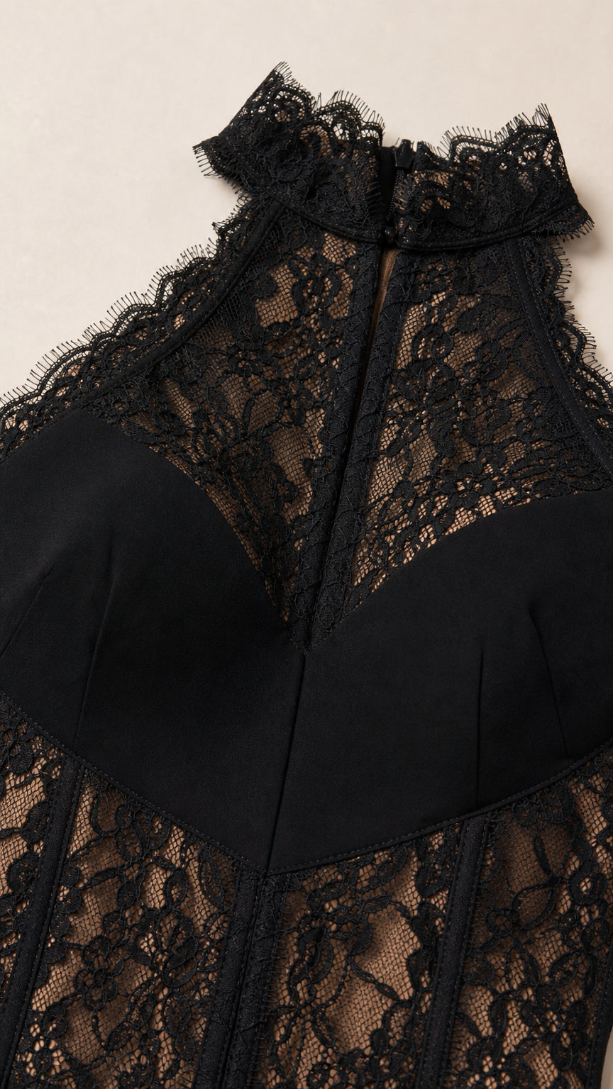 Close up detail of black halter neckline and floral lace corset bodice
