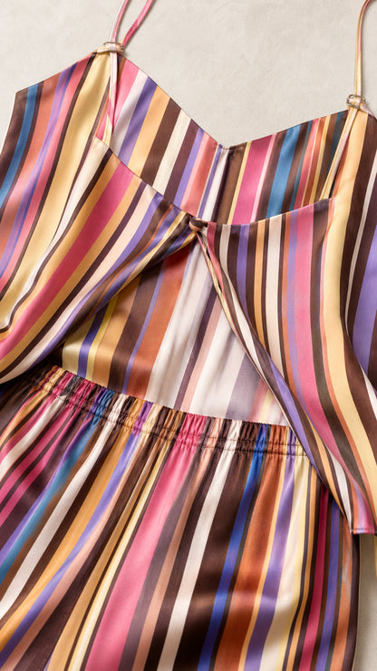 Close-up detail of smooth striped satin-like fabric and back slit construction