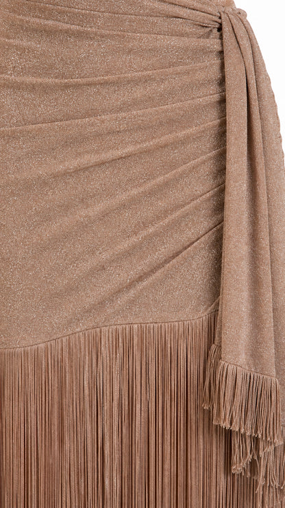 Close-up of shimmer fabric texture and fringe hem