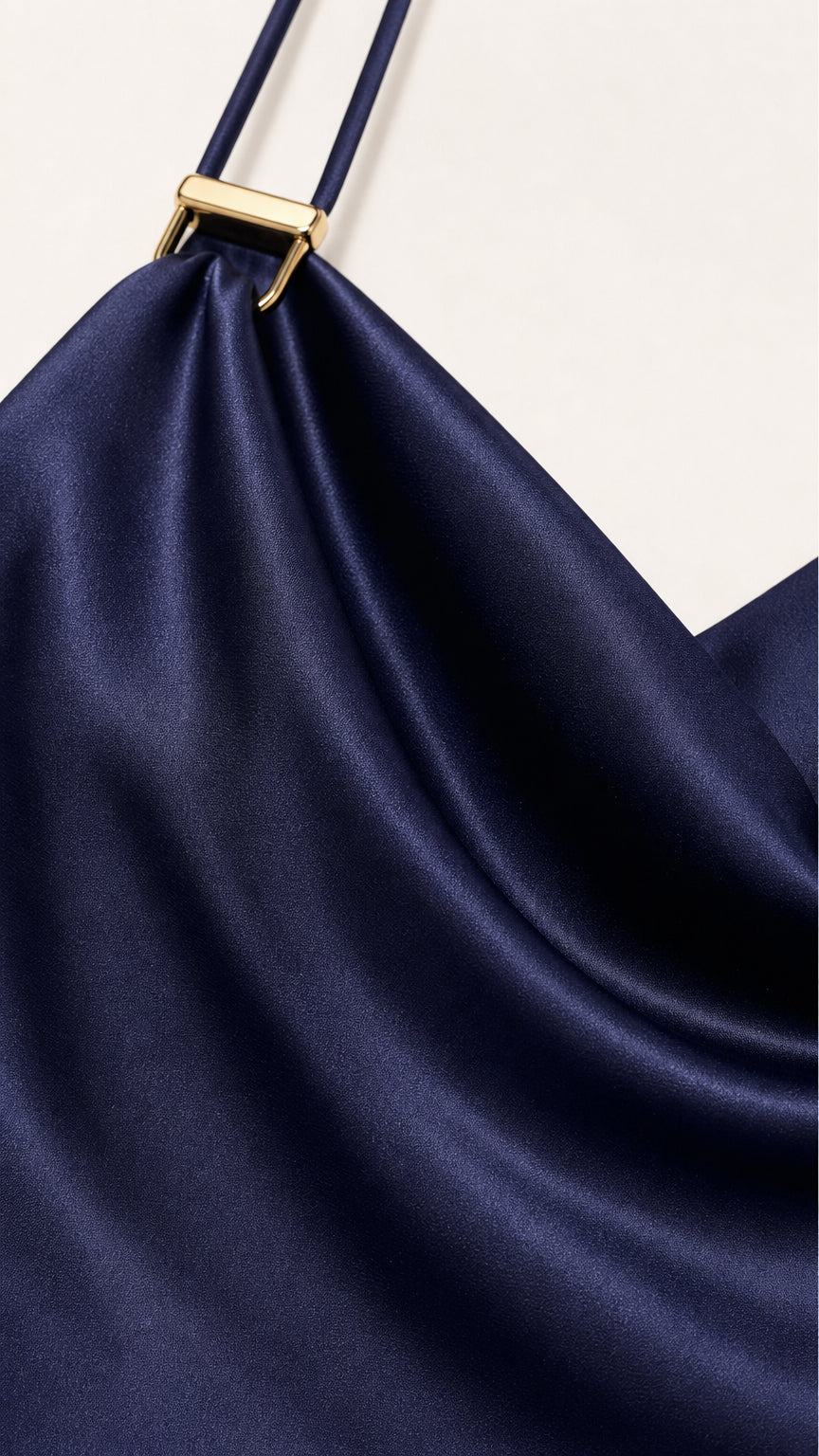 Close-up of the smooth navy satin-look fabric and strap detail