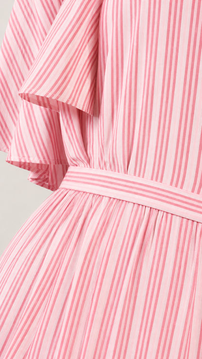 Close-up detail of pink striped dress showing flutter sleeve and waistband