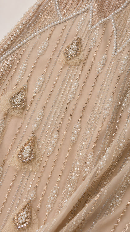 Close-up of intricate pearl and bead embellishments