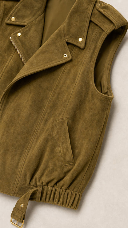 Close-up detail shot of olive green faux suede moto vest showing notched lapels, zipper, and buckle hem