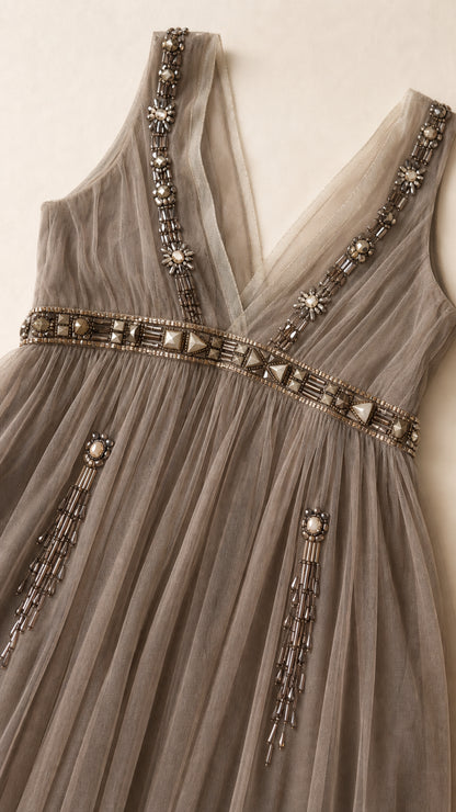 Close-up detail of rhinestone and bead embroidery on bodice
