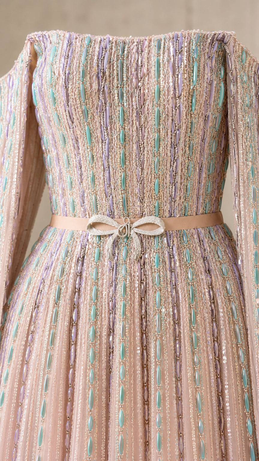 Close-up of bodice detail with vertical beading and waist bow