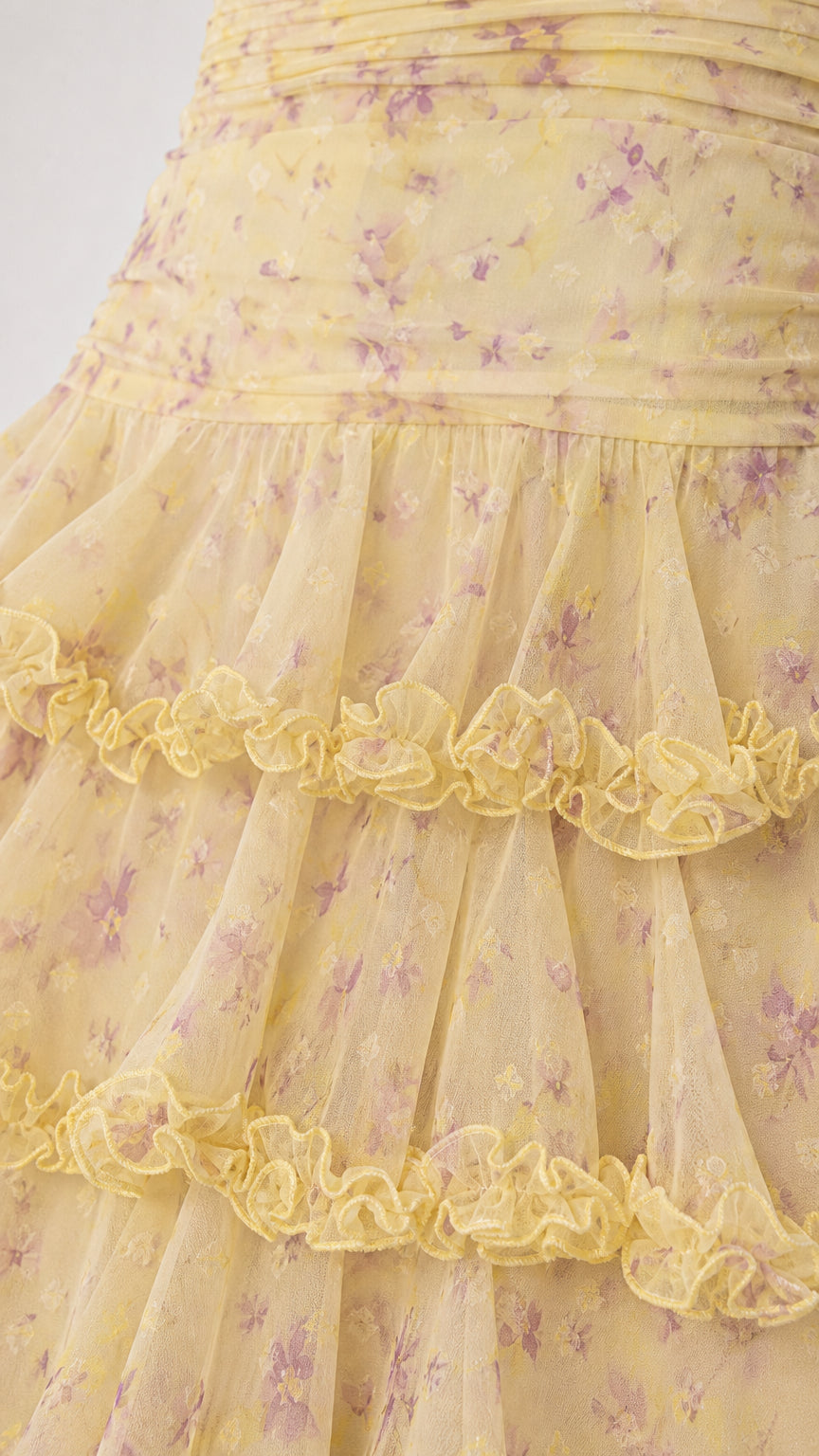 Close-up of yellow floral tiered ruffle fabric