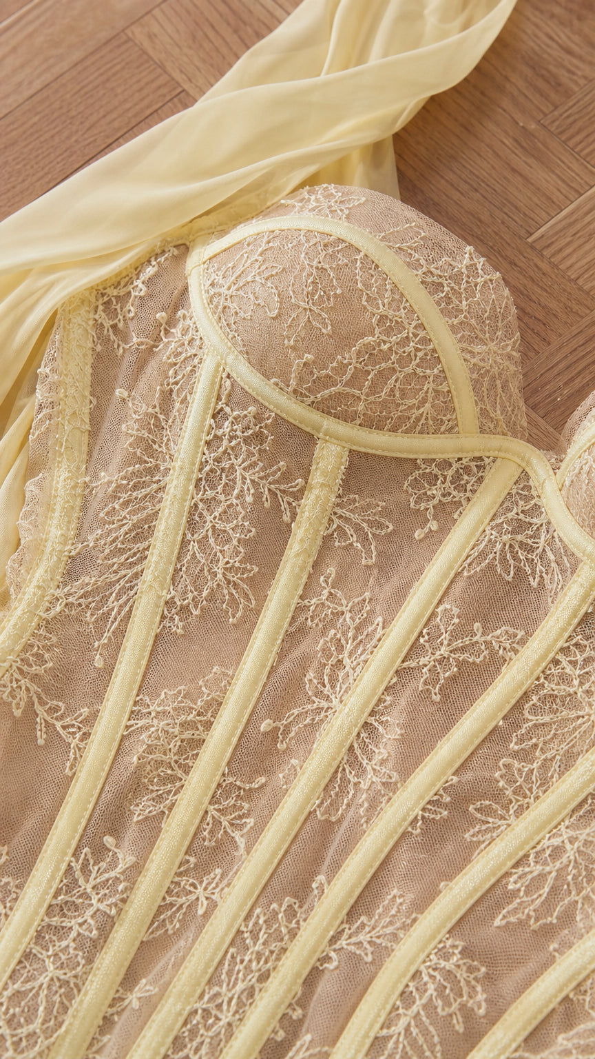 Close-up detail of structured lace bustier and boning