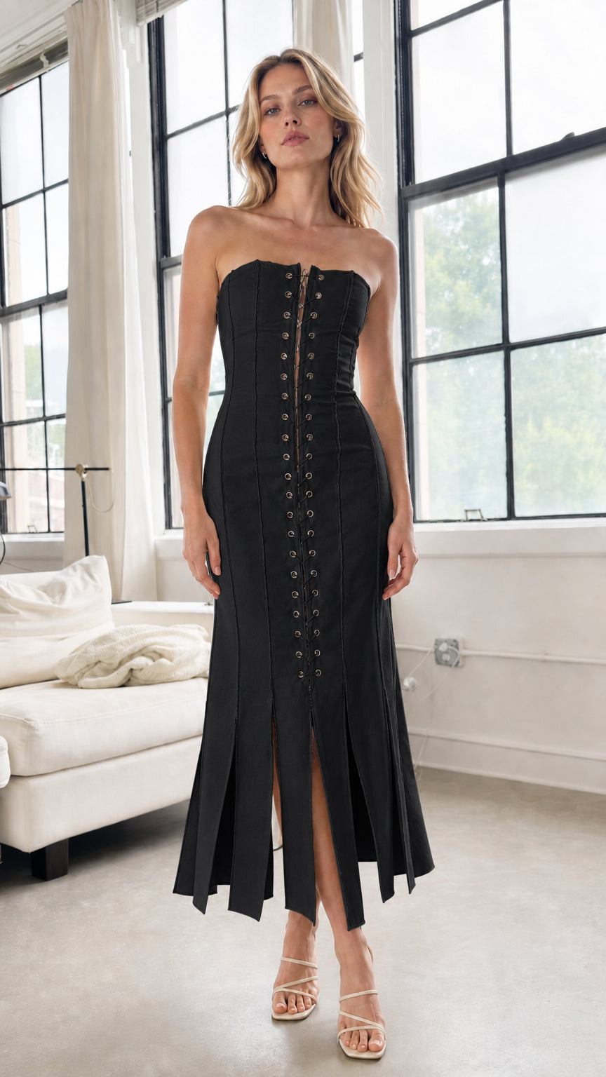 Model wearing black strapless lace-up midi dress