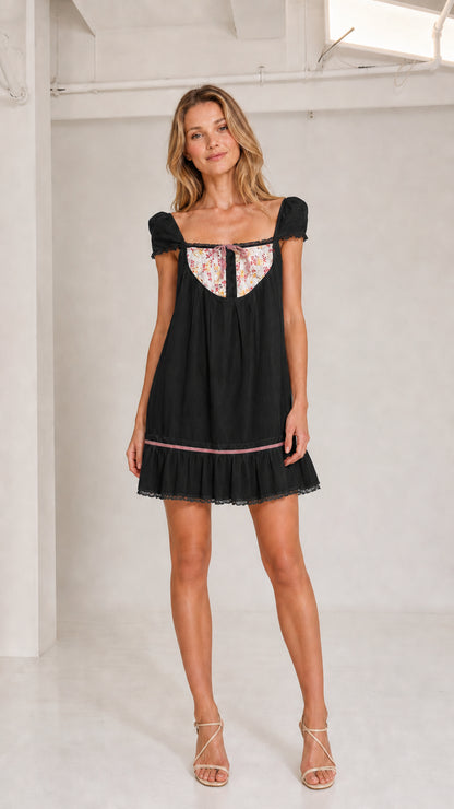 Black floral bib babydoll mini dress front view