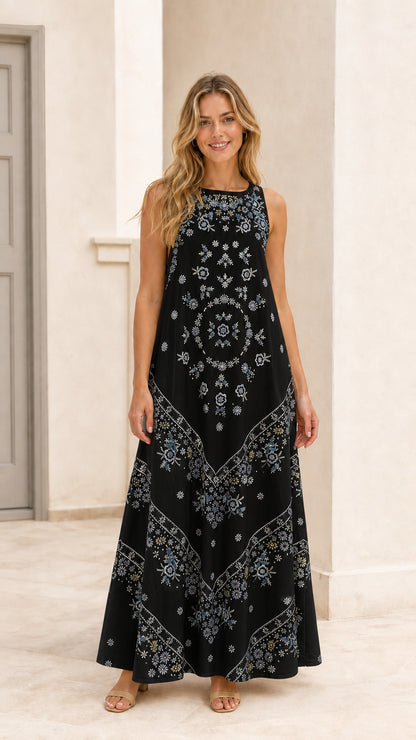 Woman wearing black floral embroidered sleeveless maxi dress