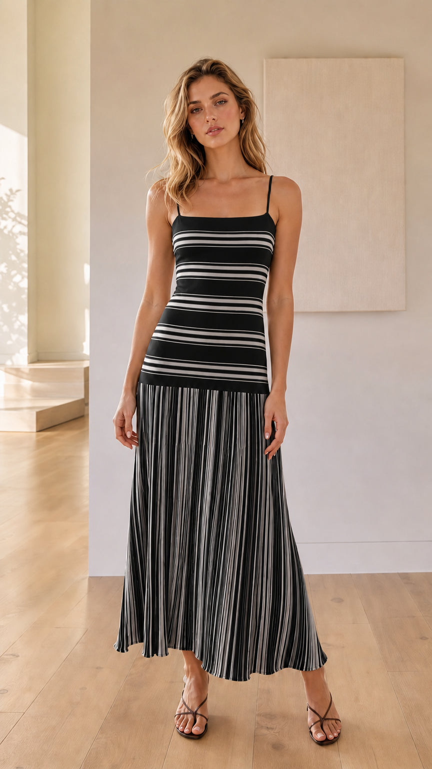 Woman wearing black striped knit maxi dress