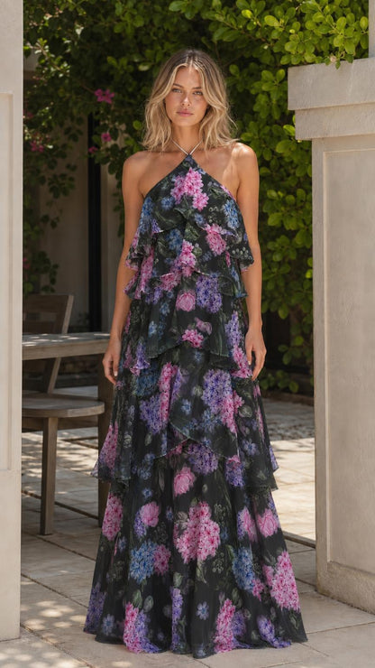 Model wearing black multi floral halter tiered ruffle maxi dress