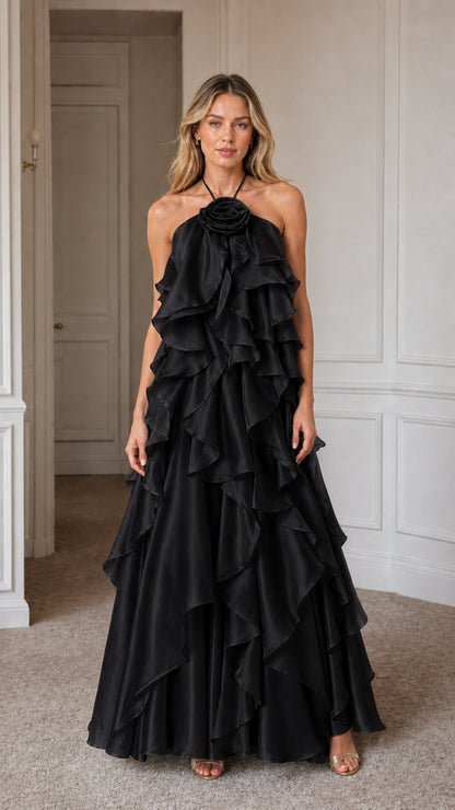 Model wearing elegant black ruffled evening maxi dress