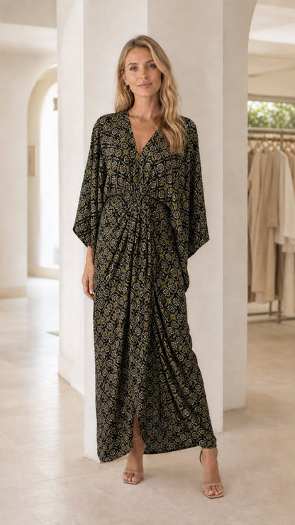 Model wearing black printed V-neck maxi dress