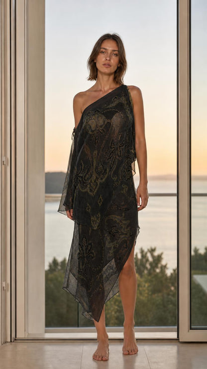 Model wearing black paisley one-shoulder maxi dress